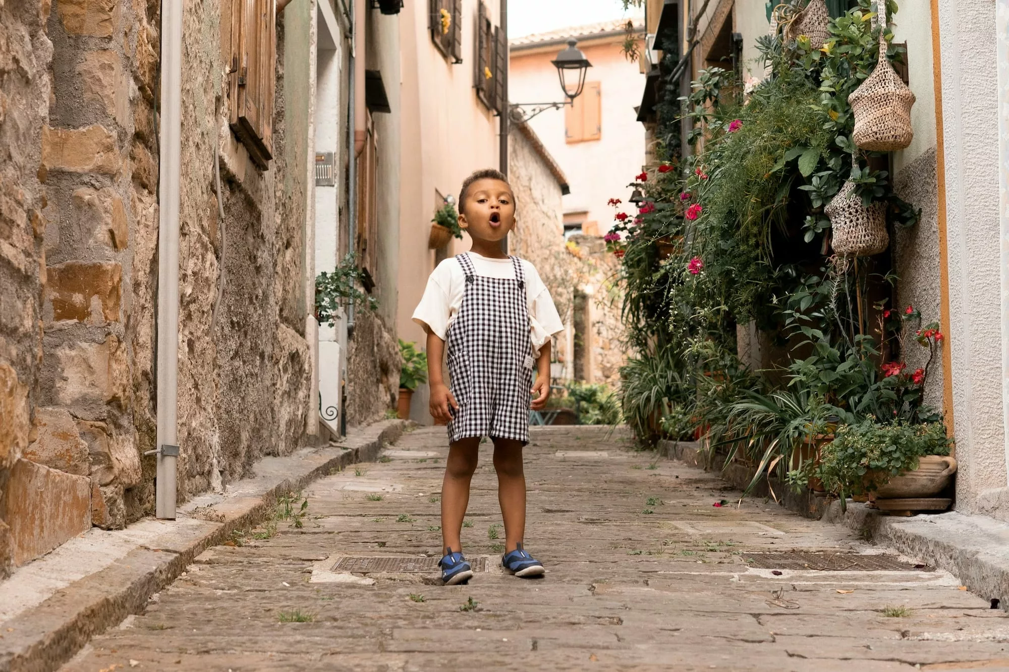 A child talking on a street.