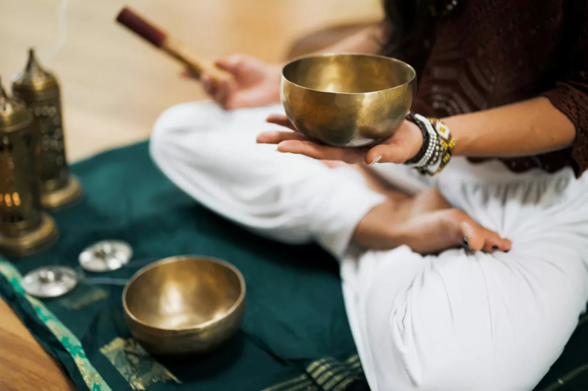 A meditator with a singing bowl.