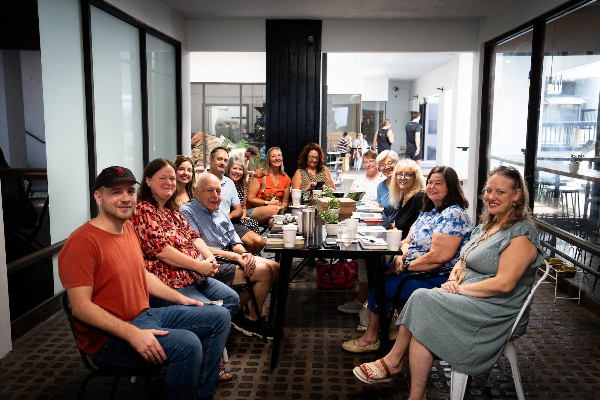 A group of LIMG members enjoying a coffee social event.